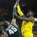 Michigan junior Tim Hardaway Jr. shoots over Michigan State freshman Denzel Valentine during the first half at Crisler Center on Sunday, March 3, 2013. Melanie Maxwell I AnnArbor.com